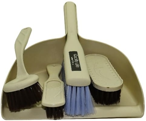 CSY-575-HZ0395-C - Computech-Solutions Beige dustpan holding several cleaning brushes, including a blue-bristled brush and white/brown-handled brushes.