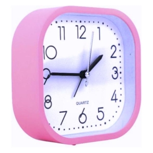 Pink square analog alarm clock with a white face, black numbers, and black hands