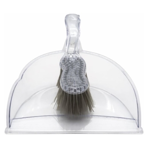 Clear plastic dustpan with an integrated brush resting on top, part of a combined cleaning set etiquette for sweeping debris into the pan.