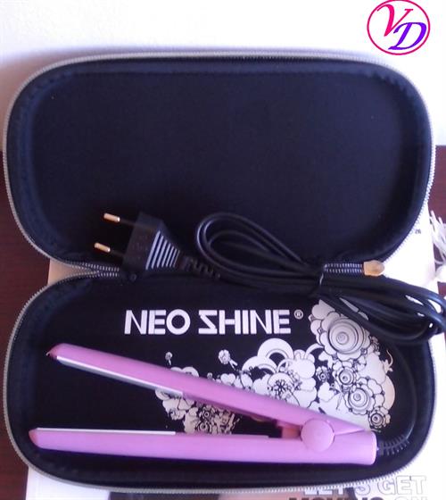 NEOSHINE01 - Computech-Solutions Pink Neo Shine hair straightener lying in an open black zip case with a coiled power cord and floral lining, ready for storage.