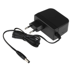 AC to DC power adapter with two-prong plug and coiled cable ending in a DC barrel connector.