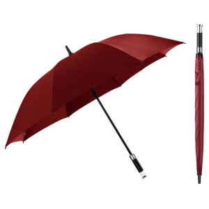 Red umbrella opened with black shaft and handle, plus a closed red umbrella standing upright to the right