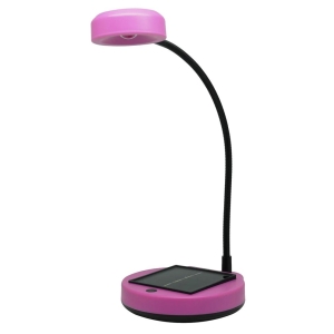 Pink desk lamp with a flexible gooseneck and a circular base; a smartphone rests on a built-in charging pad on the base.