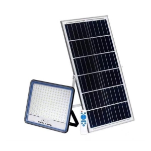 Solar panel with an LED floodlight and a remote control for outdoor solar-powered lighting setup.