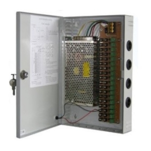 Open electrical control cabinet with a power supply, transformer, and terminal blocks visible inside the metal enclosure.