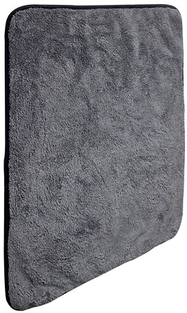 HCC101 - Computech-Solutions Gray bath towel folded with a rounded bottom-right corner, showing soft terry texture in close-up it’s a textile item.