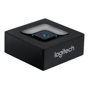 Logitech wireless USB receiver: small black cube with a glossy top showing a blue X logo and the Logitech name on the side.