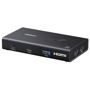 AK50275246UGREENHDMI20KVMSwitch2In1Outwr01png ComputechSolutions UGREEN 4K60Hz HDMI multiport adapter in dark gray with HDMI output, two USB 5Gbps ports, a control port on the side, and a circular top button on a sleek enclosure.