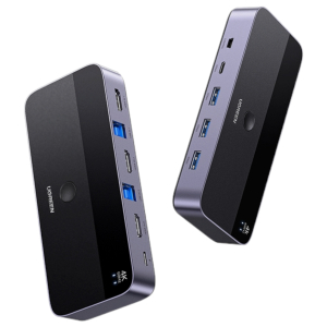 CM66415707UGREEN4K60HzHDMIKVMSwitch2In1Outwr01bjpeg ComputechSolutions Two UGREEN USB-C docking hubs with multiple ports visible, one rotated to show front and side bays.