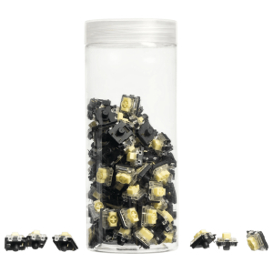Clear plastic jar filled with small black and tan LEGO bricks, with loose pieces scattered around on a white background.