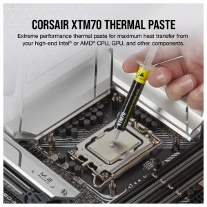 Applying Corsair XTM70 extreme performance thermal paste to a CPU socket using a precision syringe tool on a motherboard.