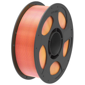 Spool of striped orange-pink 3D printing filament on a dark gray reel.