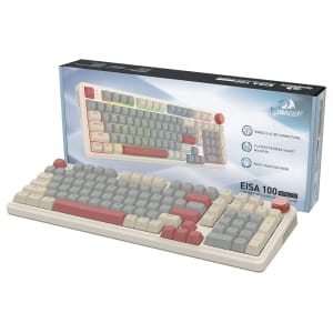 Retro beige keyboard with pastel rainbow keycaps in front of its display box.